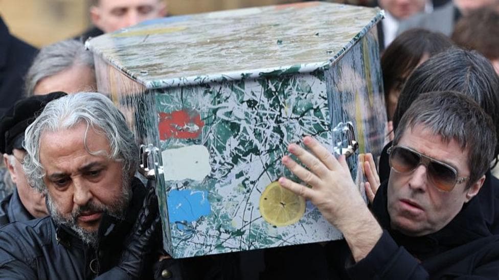 Stone Roses star Mani's coffin carried by Liam Gallagher as hundreds attend funeral