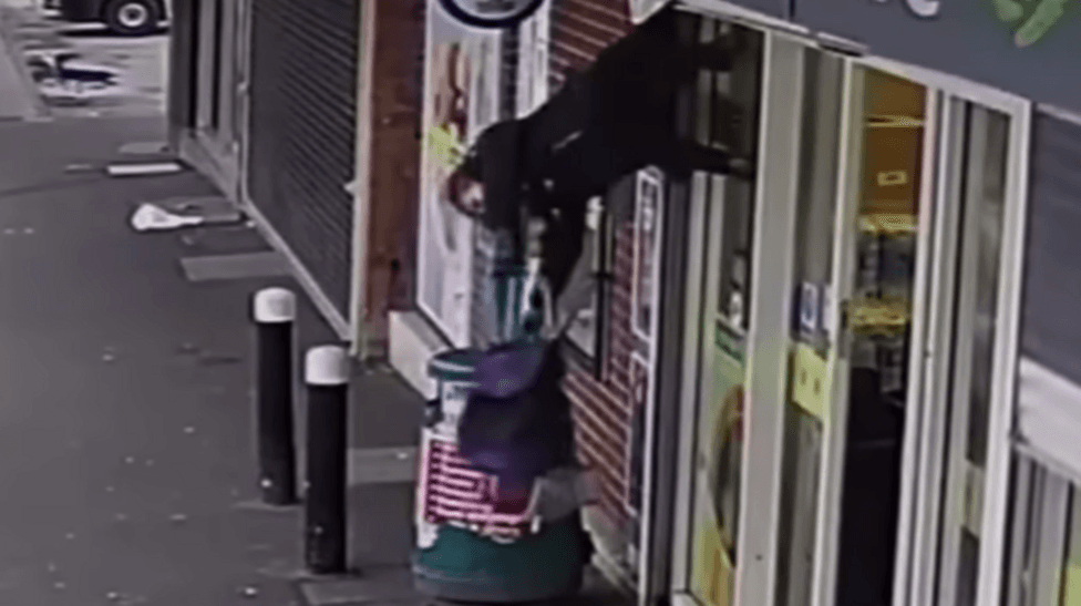 Woman hoisted into thin air by shop shutters in viral moment dies
