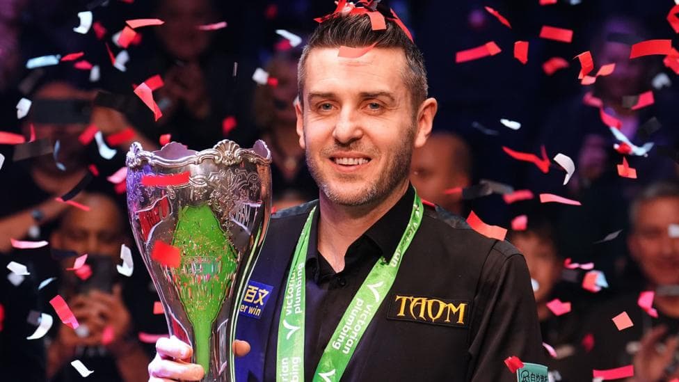 Selby holds off spirited Trump to win third UK title