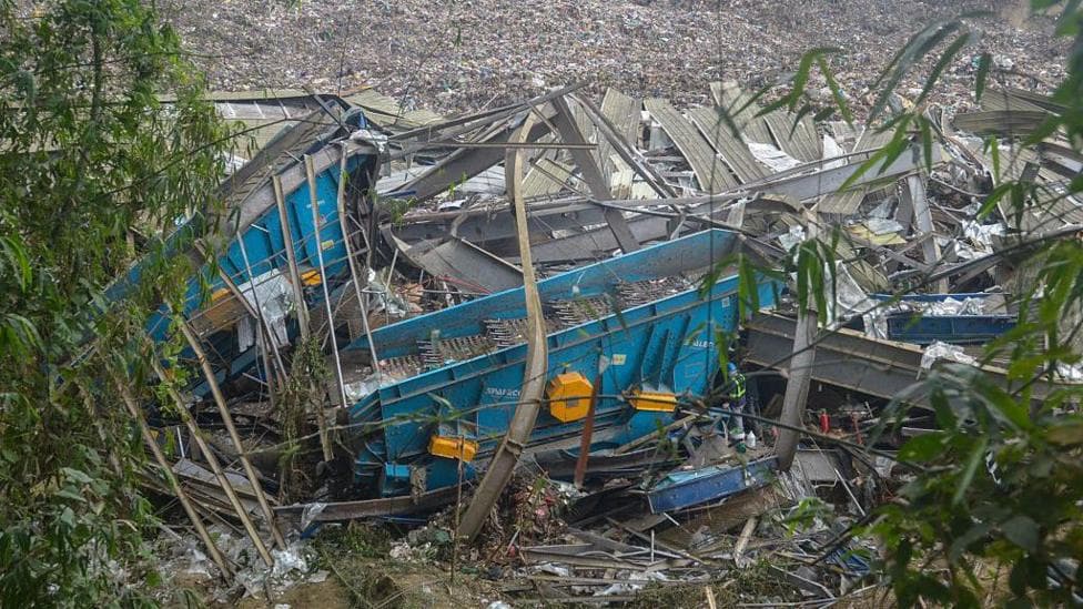 Rescuers race to find dozens missing after deadly landfill collapse in Philippines