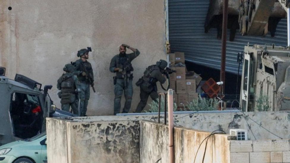 Israeli troops kill two Palestinians after they appear to surrender