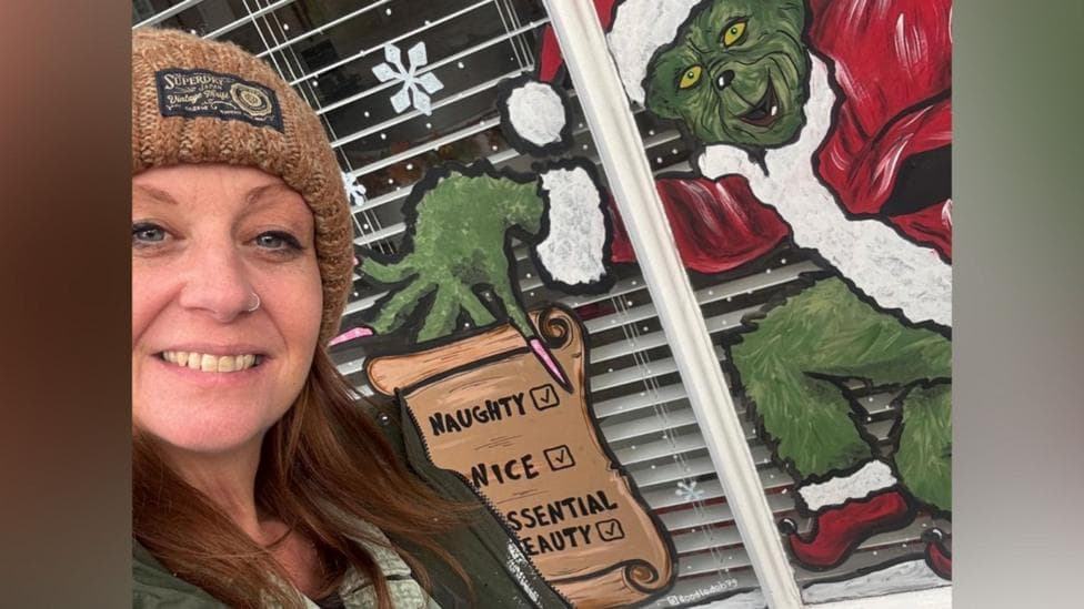 The woman who doodles Xmas scenes on windows