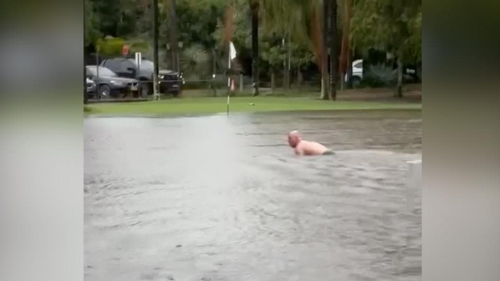 Watch: Man swims in flooded Sydney golf course after heavy rain