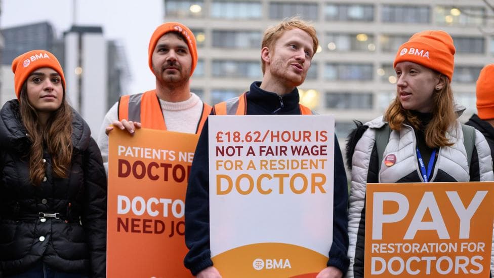 Resident doctors vote to go on strike in England as hospitals battle flu wave