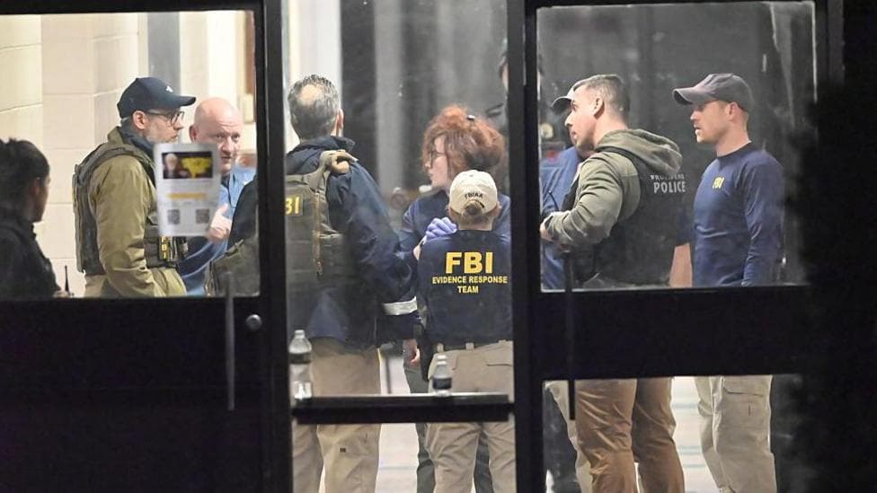 Two victims named as hunt resumes for Brown University gunman