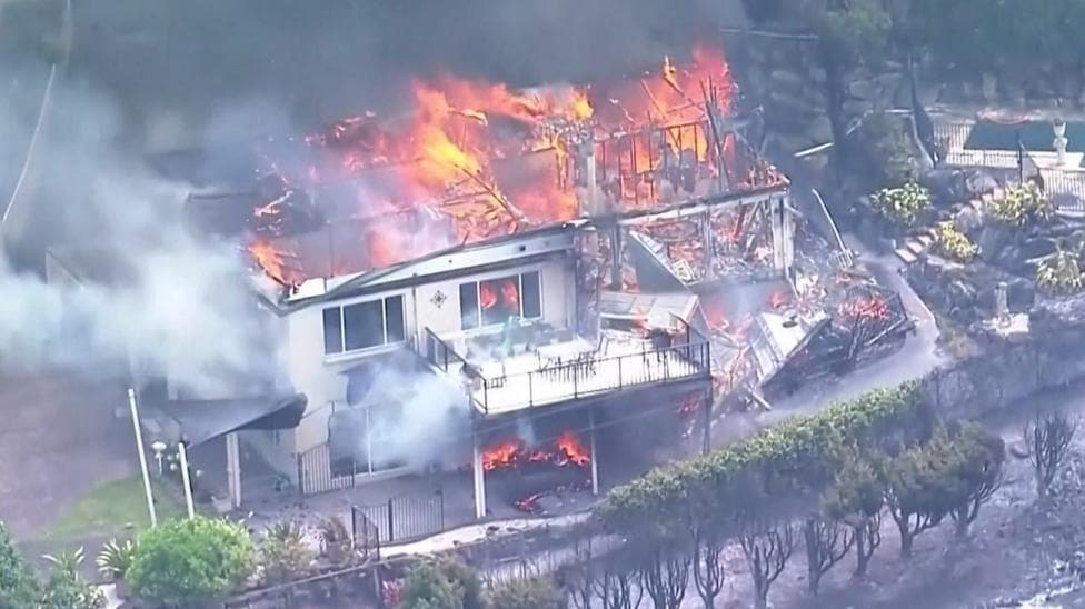 Watch: Australia wildfire rips through homes