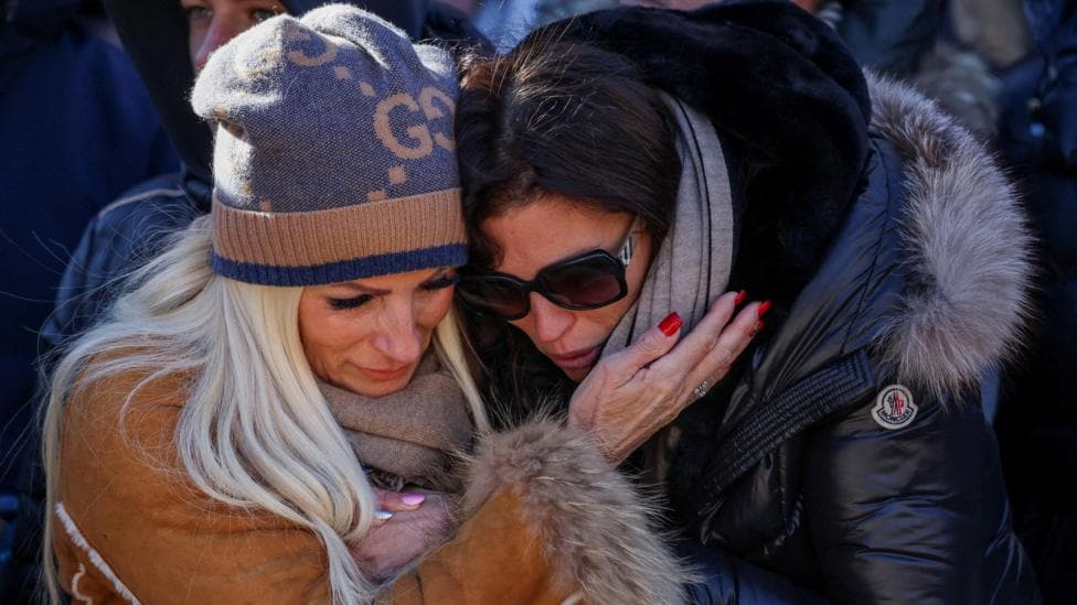 Raw emotions as mourners attend Mass for Swiss bar fire victims