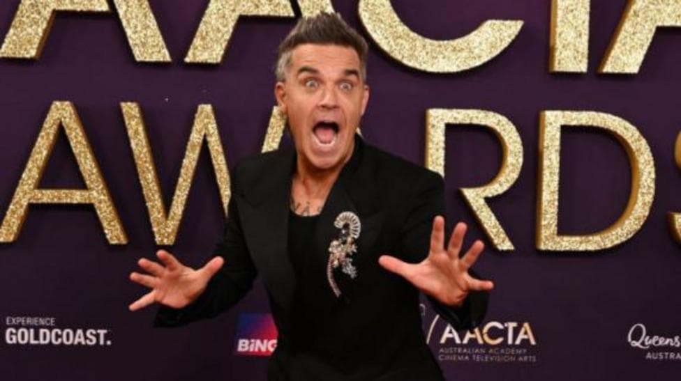 Watch moment Robbie Williams surprises 94-year-old fan