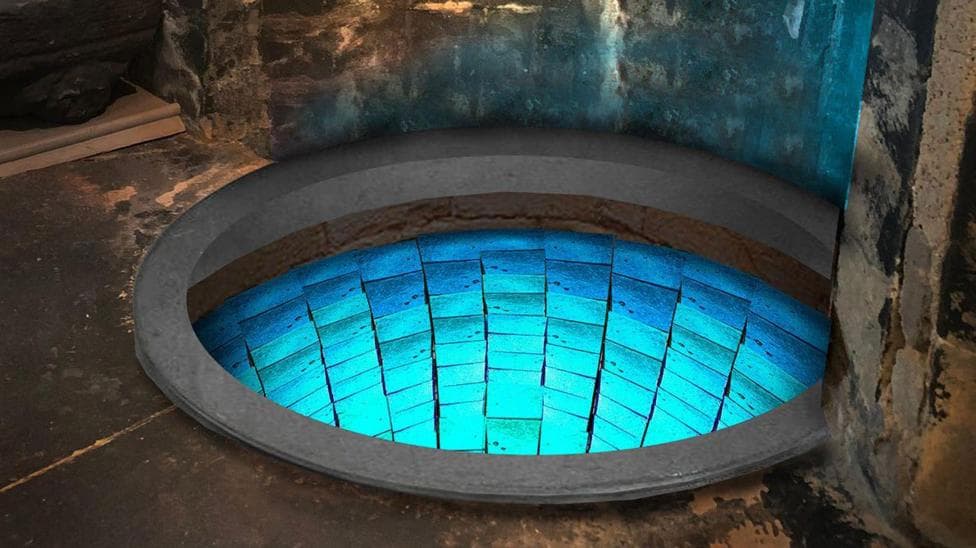 Hidden well in cathedral crypt shines blue after mosaic transformation