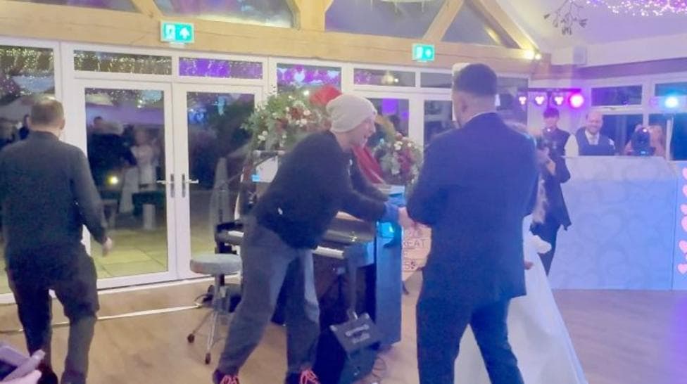 Watch: Chris Martin surprises couple with performance at their wedding